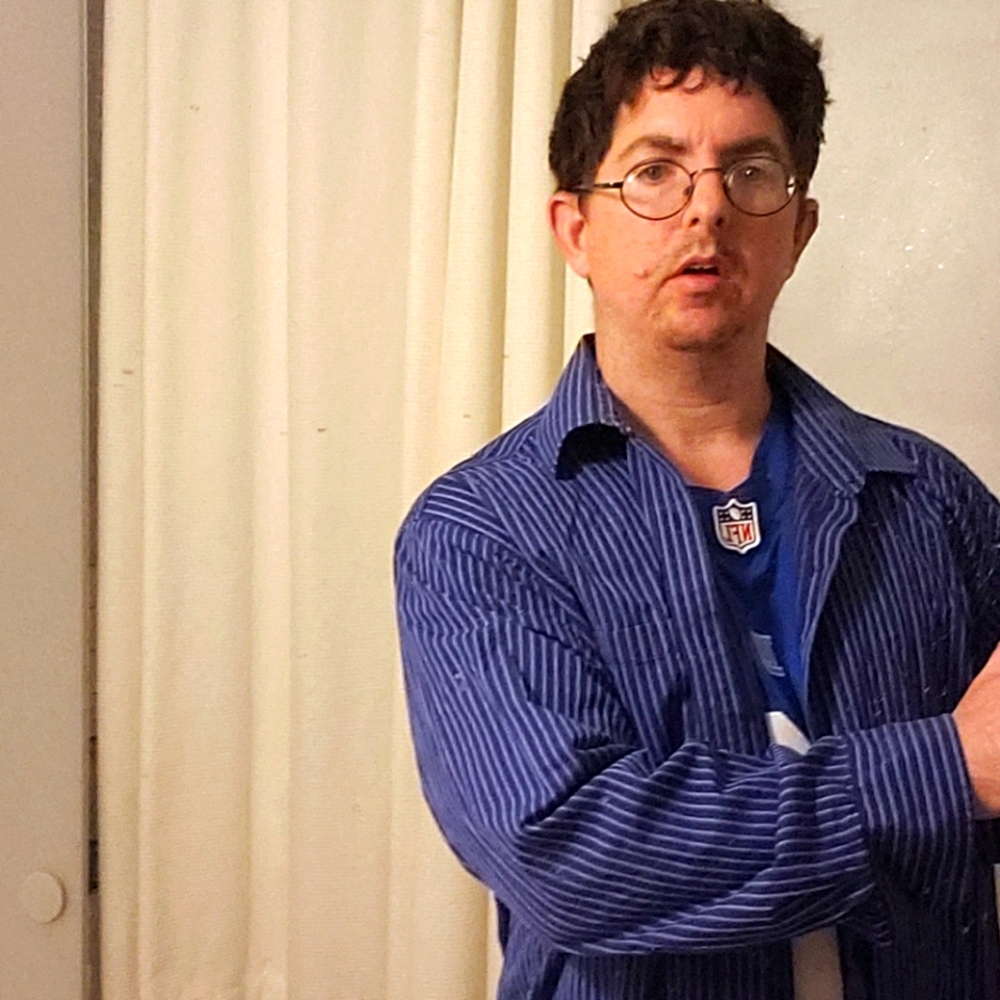 This is a Michael Kors size 18 blue striped shirt.